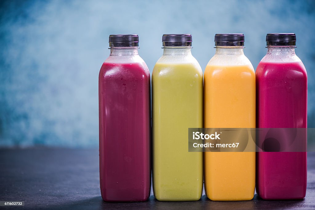 Colorful smoothies in plastic bottles Colorful and vivid smoothies in plastic bottles Detox Stock Photo