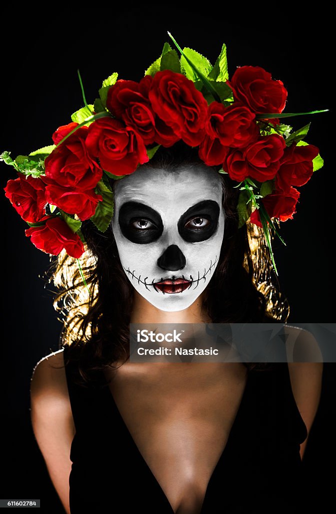Sugar skull makeup Attractive young woman with sugar skull makeup isolated on black Ceremonial Make-Up Stock Photo