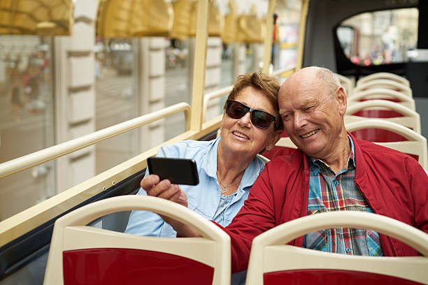 istock happy couple taking souvenir pictures 611603964