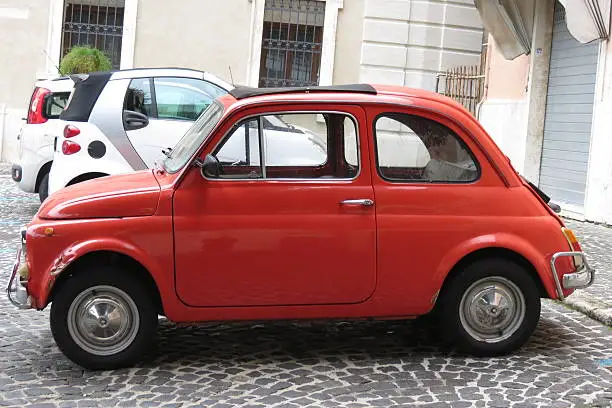 VITERBO, ITALY - OCTOBER 18, 2015: red Fiat 500 parked in a square in the city centre
