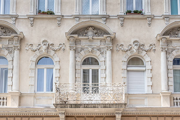 Facade of an old appartment buidling with a lot of ornamental details in Budapest Hungary with a lot of ornamental details