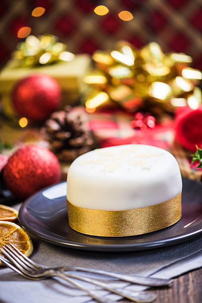 istock Christmas fruit rich cake, decorated with festive ornaments 611605224