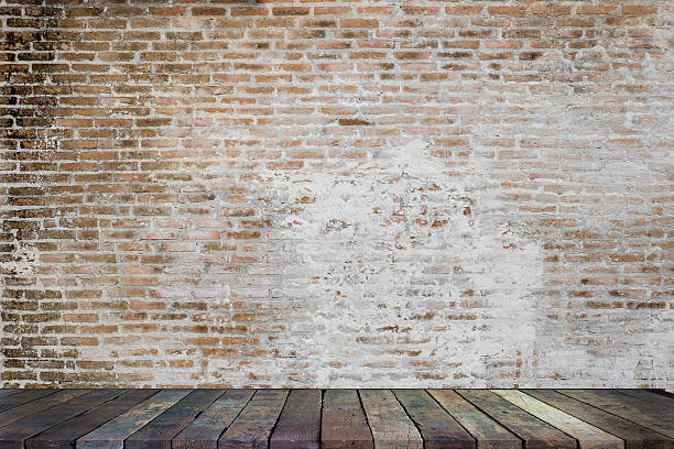 istock Empty top wood in front of a red brick wall 611605442