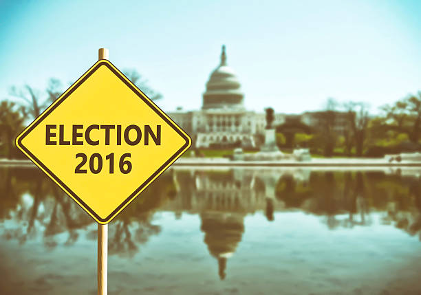 istock Election 2016 sign with Washington DC Capitol on background 611605586