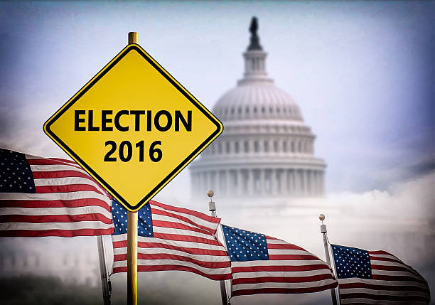 istock Election 2016 sign with Washington DC Capitol on background 611605666