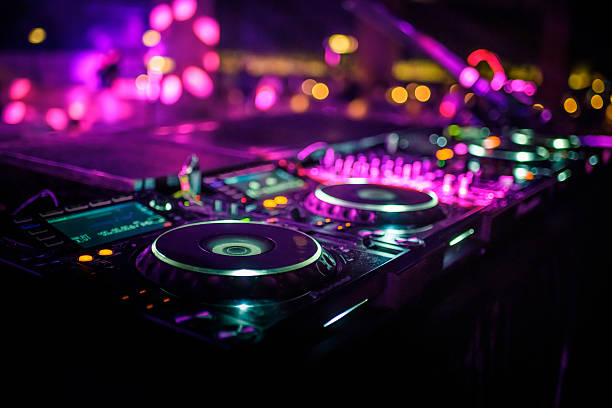 DJ console desk at nightclub DJ console desk at nightclub dance music photos stock pictures, royalty-free photos & images
