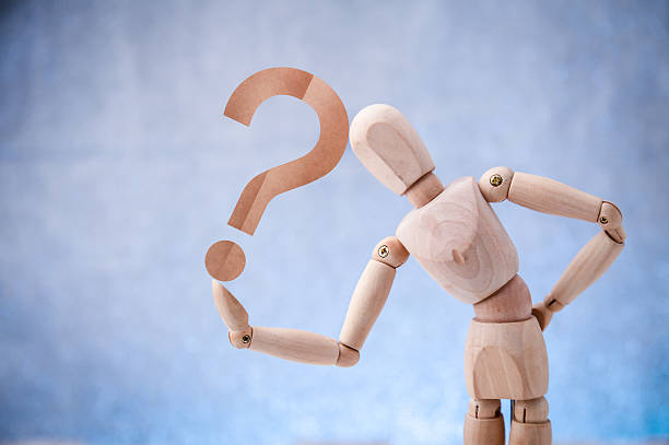 istock Wooden figure showing question mark symbol 611609050