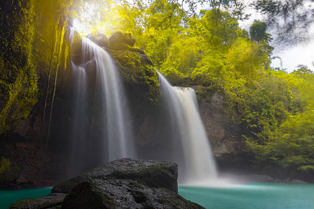 istock Amazing beautiful waterfalls in autumn forest 611609710