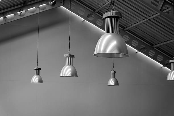 istock Big lamp silver on ceiling factory, black and white tone 611612372