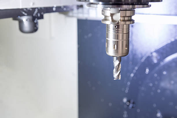 istock Closeup of the cutting tool on the CNC milling machine. 611612444