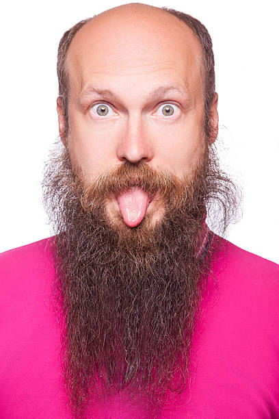istock Bald man with big eyes and tongue. 611612950