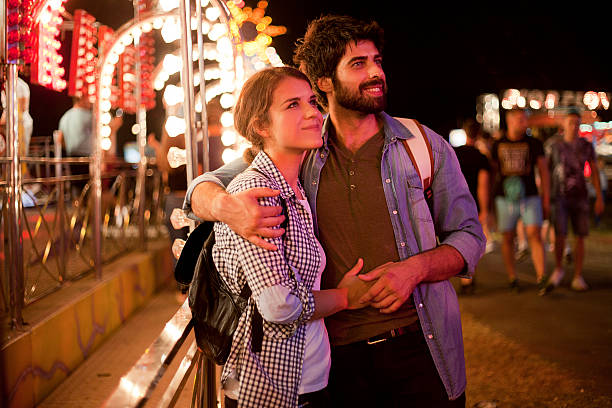 istock Romantic couple at amusement park 611614272