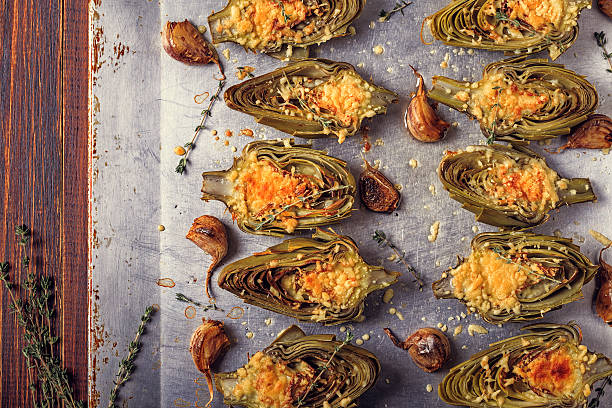istock Artichokes baked with cheese, garlic and thyme. 611615706