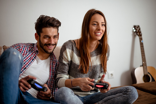 Cropped shot of a couple playing video games.