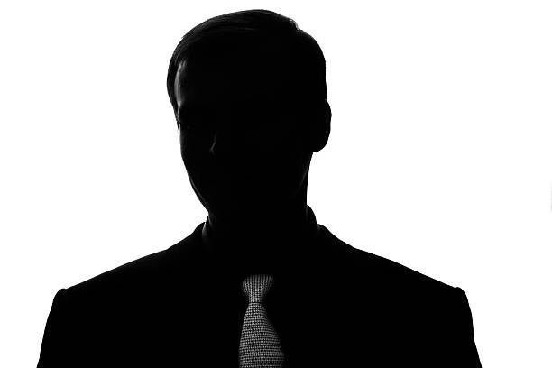 istock Portrait young man in suit, tie in silhouette, front view 611618018