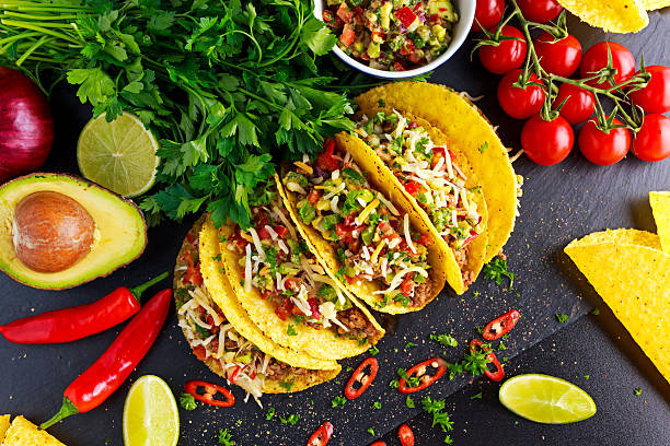 istock Mexican food - delicious taco shells with ground beef and 611620822