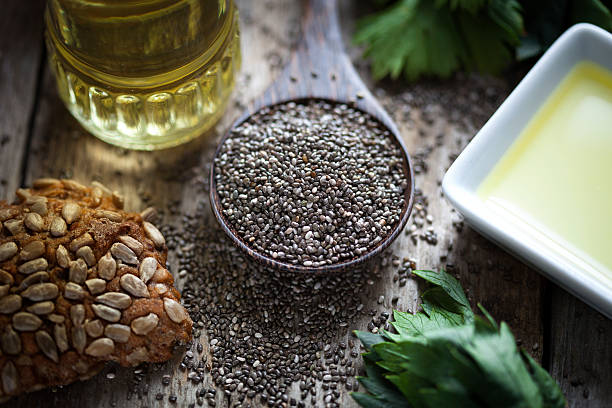 istock Wooden spoon oil chia seeds bread 611623180