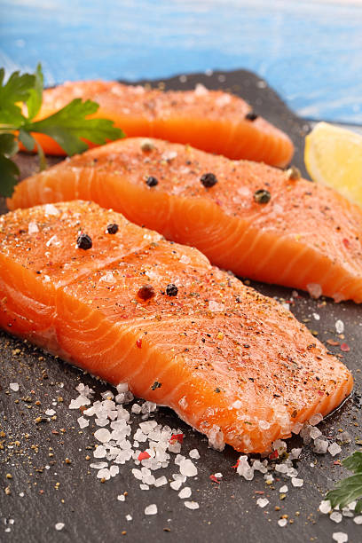 istock Fresh salmon with herbs and spices 611623342