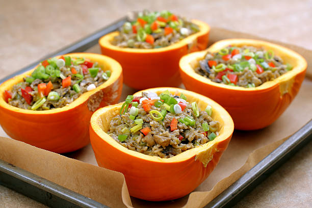 istock Autumn stuffed pumpkin with rice and mushrooms ready to bake 611623892