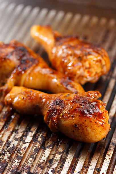 istock Hot grilled chicken legs on the grill 611624794
