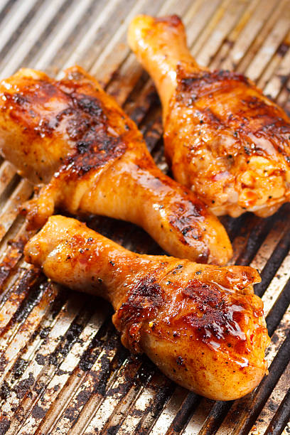 istock Hot grilled chicken legs on the grill 611624842