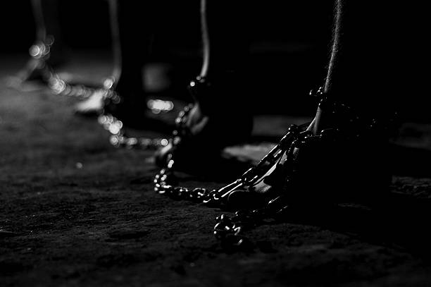 prisoner captive, prisoner, capture, slave, bondslave, bondman, bondsman, helot, thrall,captivity, slavery, enslavement, bondage, enthrallment, enthralment, servitude, thraldom, thralldom,Slavery slavery stock pictures, royalty-free photos & images