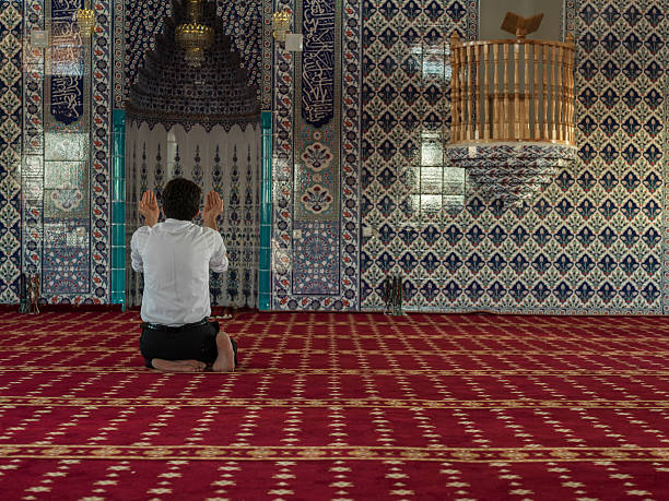 istock Rare View Of Muslim Man Praying Mosque 611625694