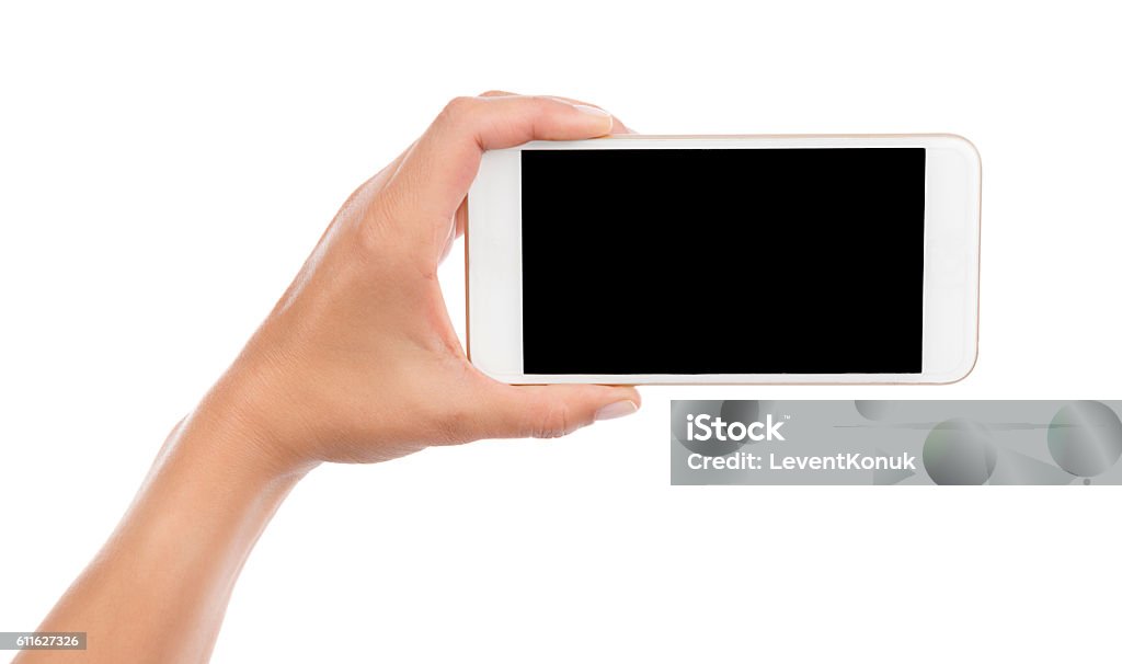 Taking Photo with Cell Phone Isolated Female hand taking photo with smart phone isolated on white background.    Selfie Stock Photo