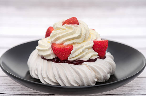 A fresh cream strawberry pavlova dessert.