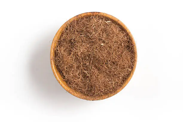 Photo of Dry Corn Silk Herb into a bowl. Stigmata Maydis