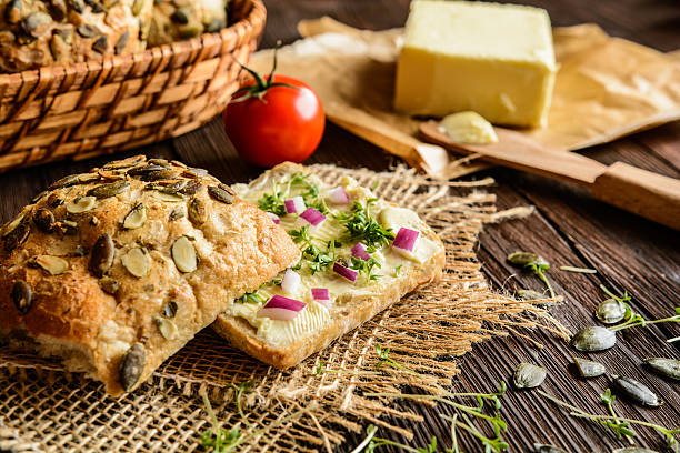 istock Whole grain rolls with butter, onion and cress 611632452