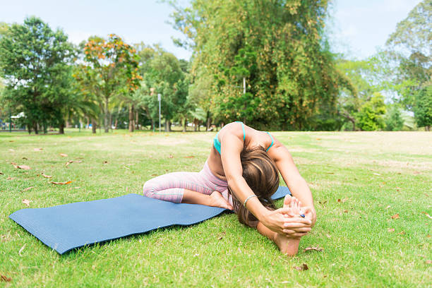 istock Yoga practice at the park 611632674