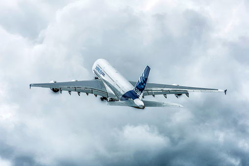 Farnborough, England - July 17, 2016: The Airbus A380, the worlds largest passenger airliner, during it’s flying display at the Farnborough International Air-Show.