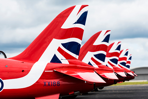 Farnborough, England - July 17, 2016: Tail wings of the Red Arrows  sitting on the ground at the Farnborough Airshow.