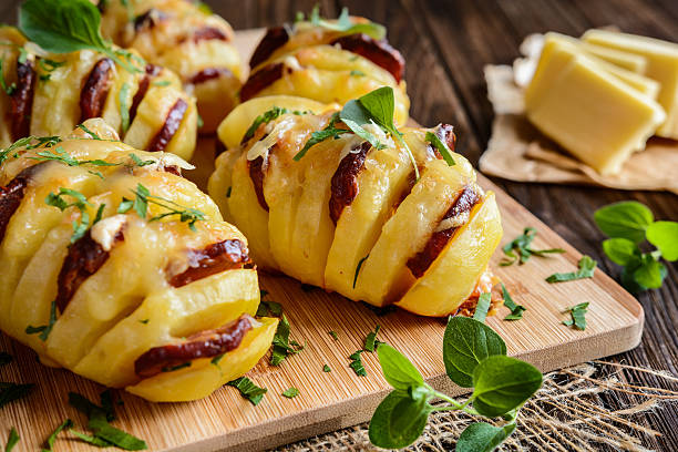 Baked potatoes stuffed with sausage, cheese, garlic and herbs