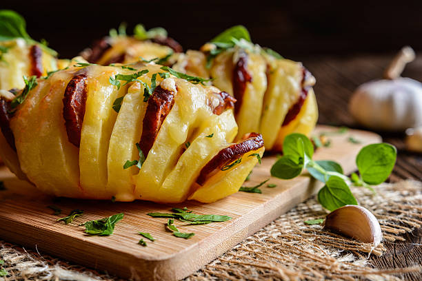 istock Baked potatoes stuffed with sausage, cheese, garlic and herbs 611633726