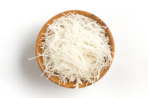 Chinese Noodles. Rice vermicelli Pasta into a bowl isolated in white background