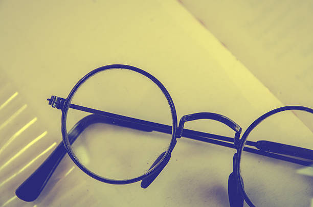 istock Artwork in retro style, Spectacles and book , vintage styled 611636596