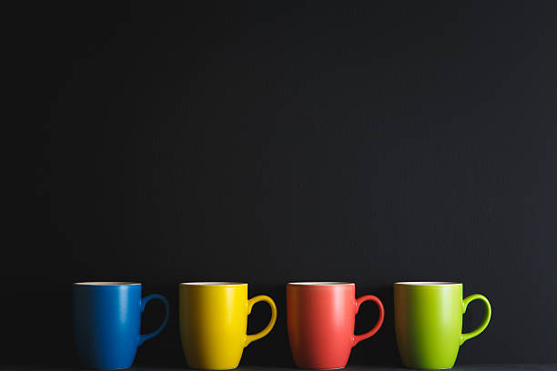 Set of Realistic ceramic cups or empty mugs for coffee, drink or tea on White Background. White, Black, Blue, Green, Red and Yellow colors. 3D Rendering 3D Illustration