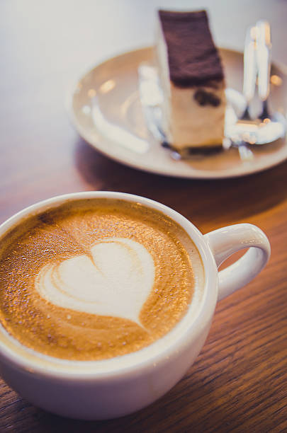cup of cafe latte and cake