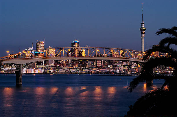 Auckland city view from North Shore View of Auckland city at dusk with harbour bridge in foreground,  Waitemata Harbor stock pictures, royalty-free photos & images