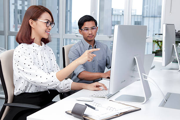 istock Business people having a discussion in office 611749752