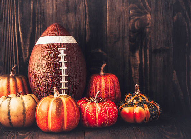 istock American football with assorted pumpkins 611749784