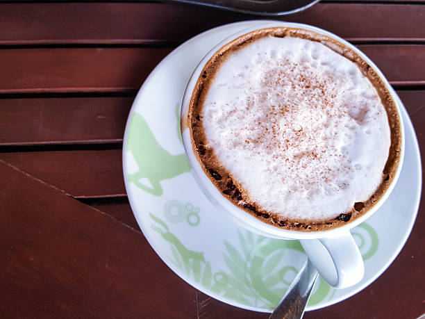 istock Coffee cup on the wood table backgrounds 611750066