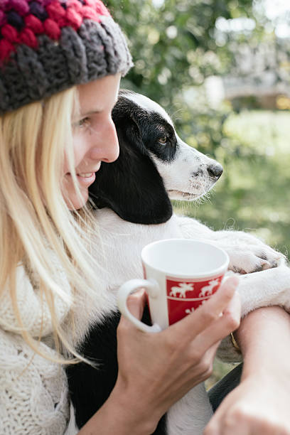 istock Woman and her puppy drinking together 611754444