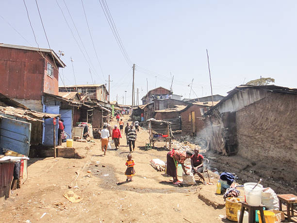 Kibera slum near Nairobi Kibera, Kenya - September 16, 2013: Many people on the street of Kibera slum near Nairobi. Kenya. Eastern Africa xxi stock pictures, royalty-free photos & images