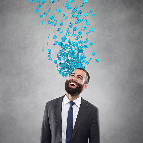 istock Excited Businessman looking up with flying alphabets 611757670