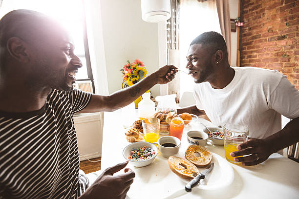 istock homosexual couple doing breakfast on the kitchen togetherness 611758598