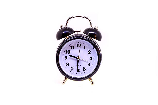 istock Black alarm clock isolated on white background. 611759002