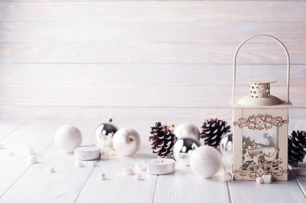 istock Burning lantern in the snow with christmas decoration 611759598